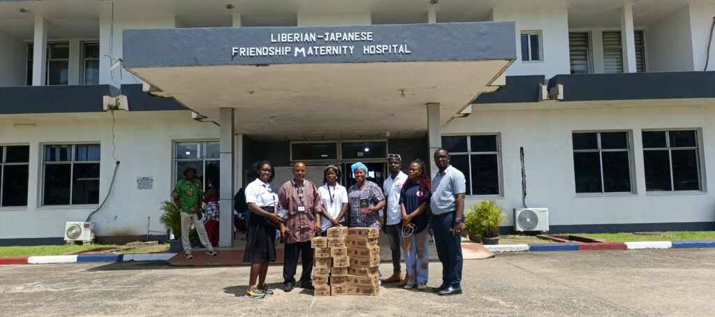 Students receive menstrual hygiene education and sanitary pads during a community outreach program in Monrovia, Liberia.