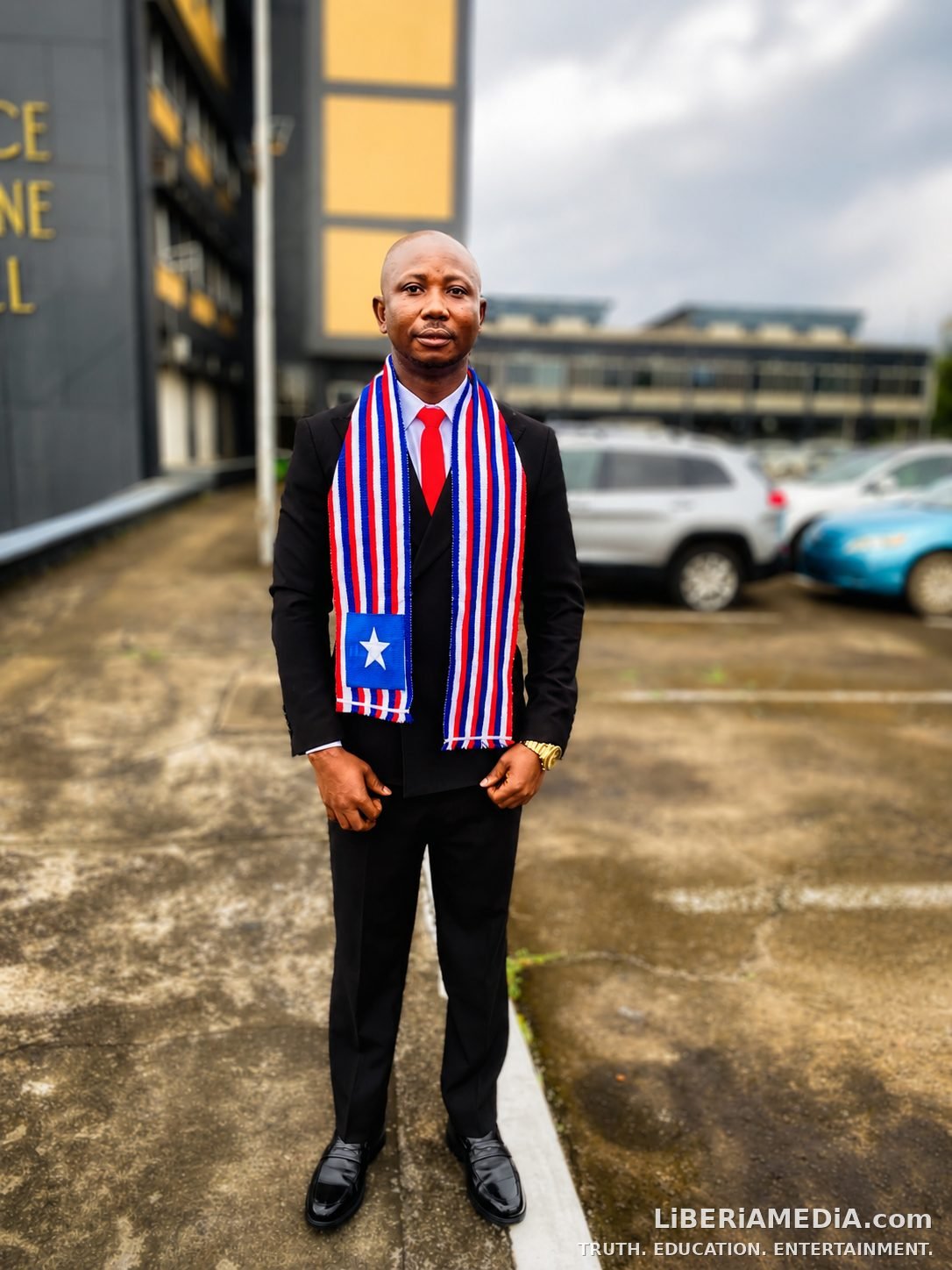 Josiah Wiah Outside the Temple of Justice Josiah Wiah, PMTP V valedictorian, poses in Liberian flag scarf outside the Temple of Justice