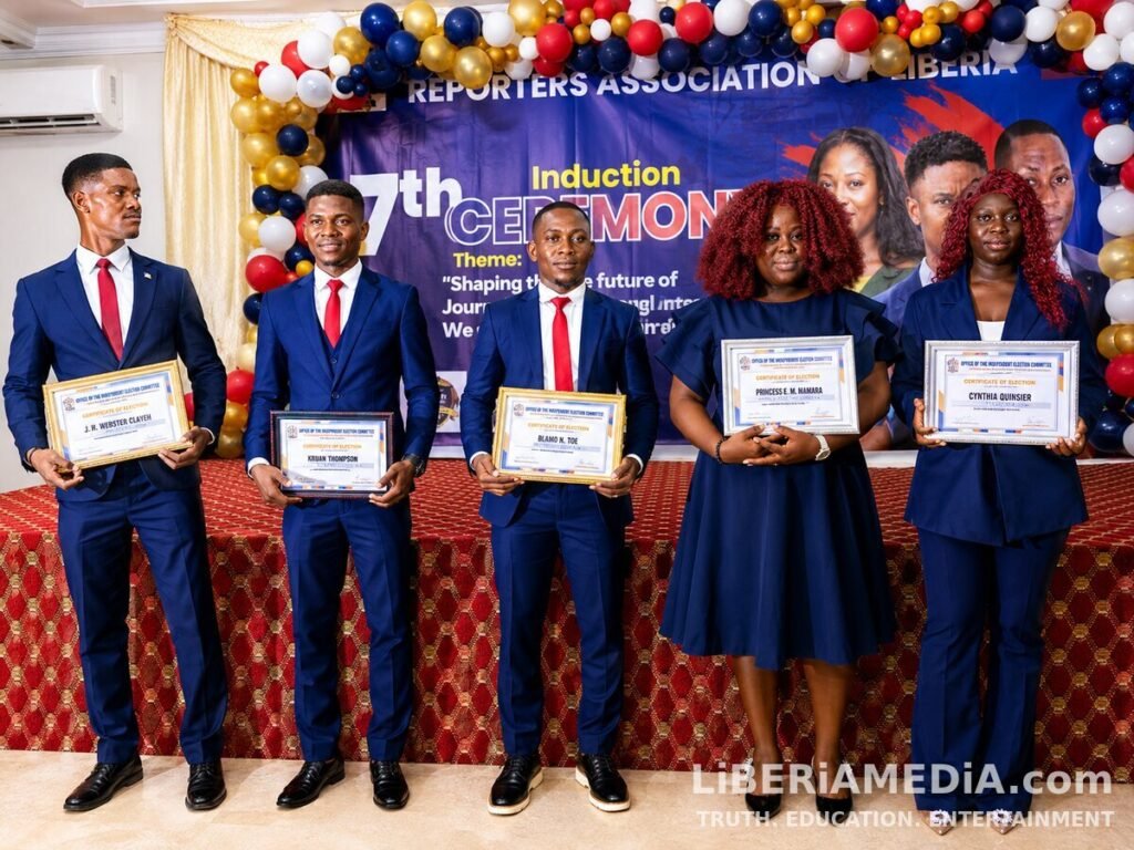 Newly inducted officials of the Reporters Association of Liberia pose with their certificates during the 7th Induction Ceremony in Monrovia.