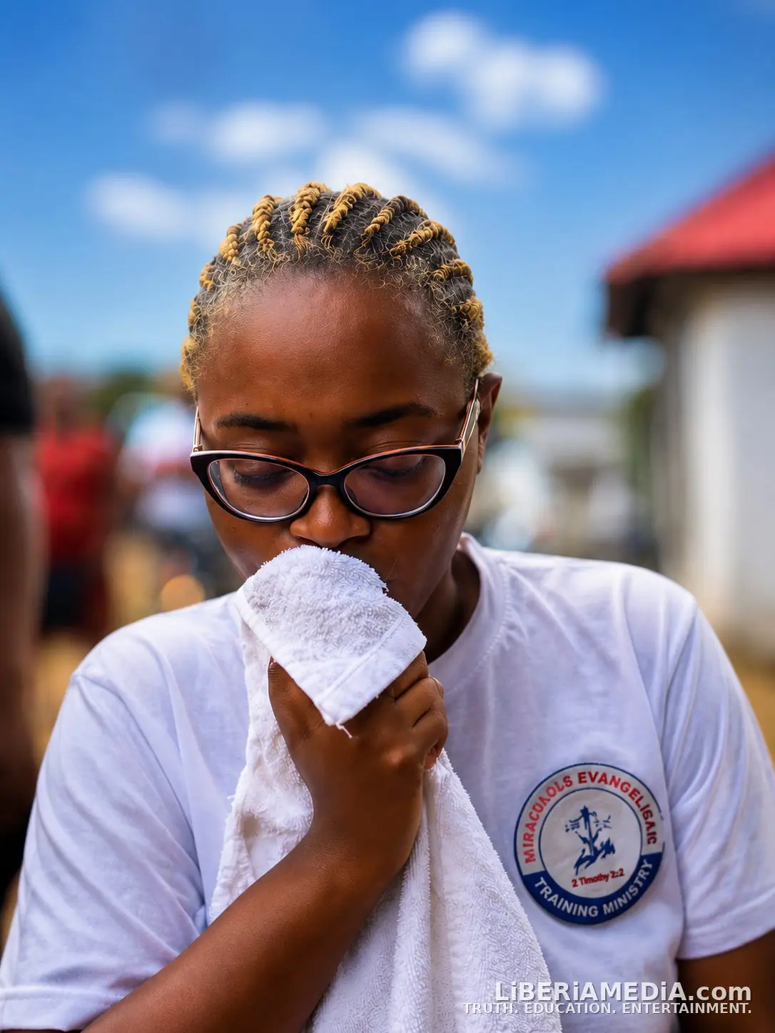 Stelior Kettor wipes her face while recounting her mother Amb. Miracle A. Kettor's final hours